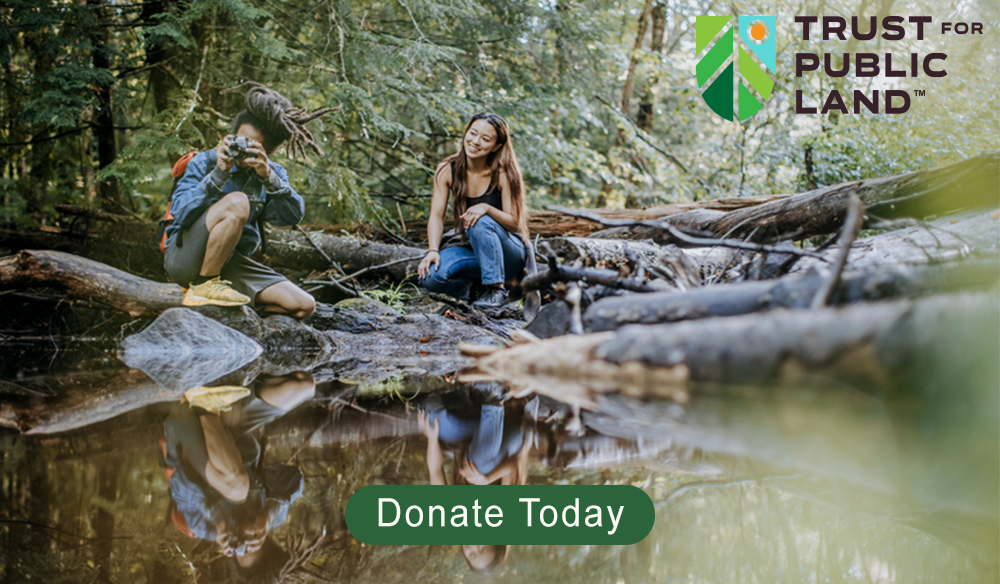 Hikers on river bank